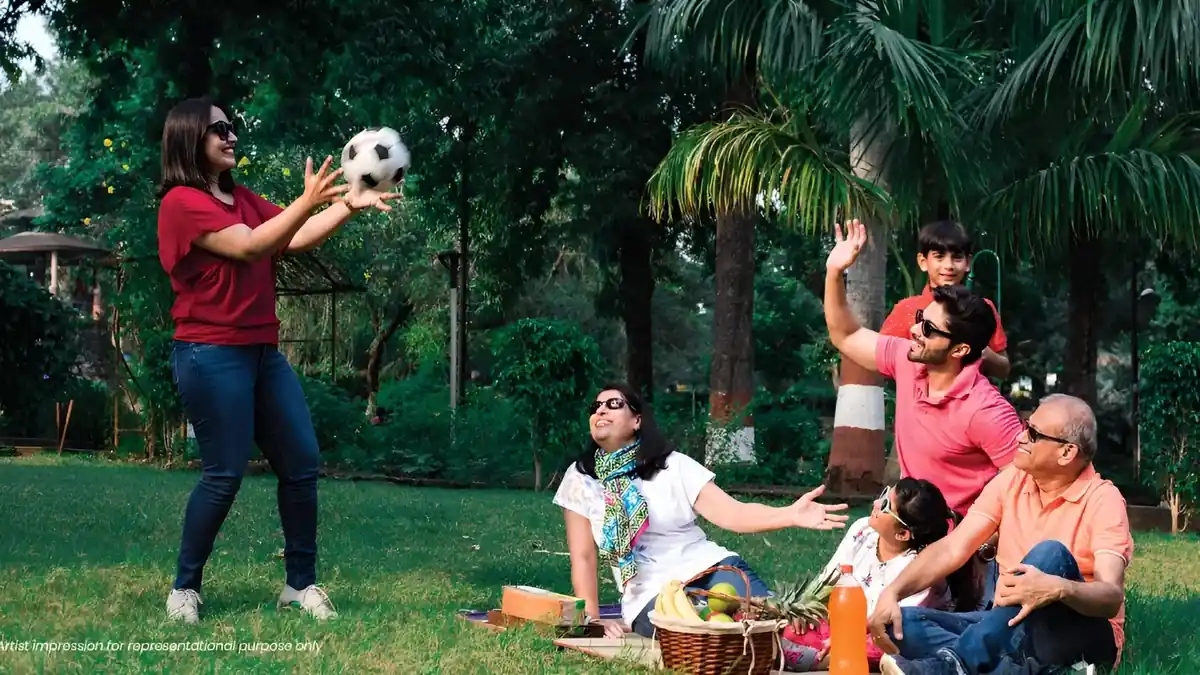 Family enjoying landscaped open spaces at Embassy Biome, North Bangalore